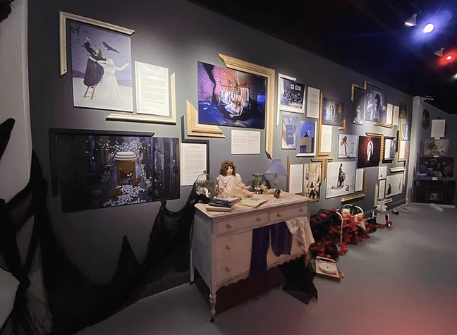 Photo of old desk with a doll sitting on top