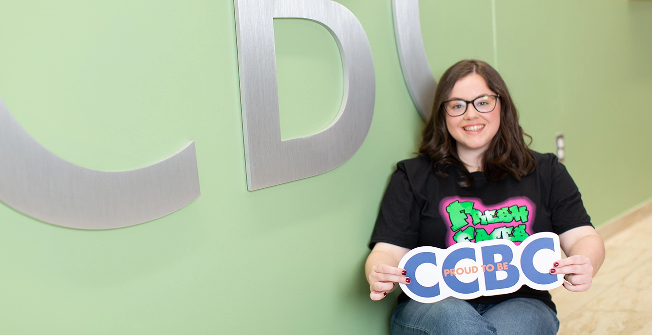 Shila Marshall poses in front of CCBC sign