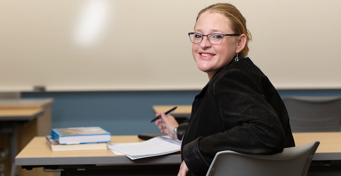 Student sits in a classroom