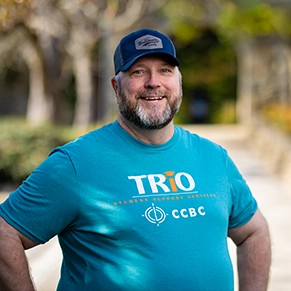 A student wearing a light blue TRIO shirt.