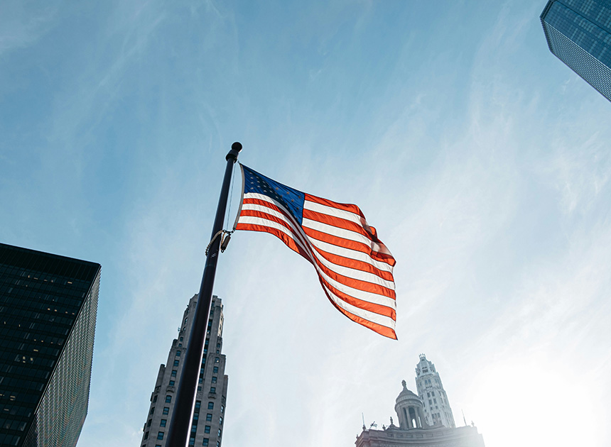 Photo of American flag flying in the wind.