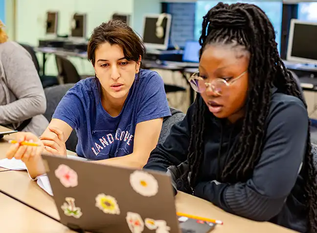 Two students working together in class