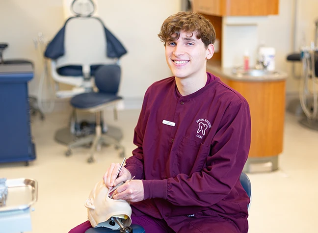 Dental Student working with mannequin