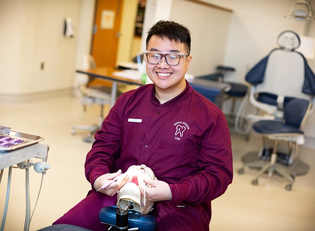 Dental Student working with mannequin