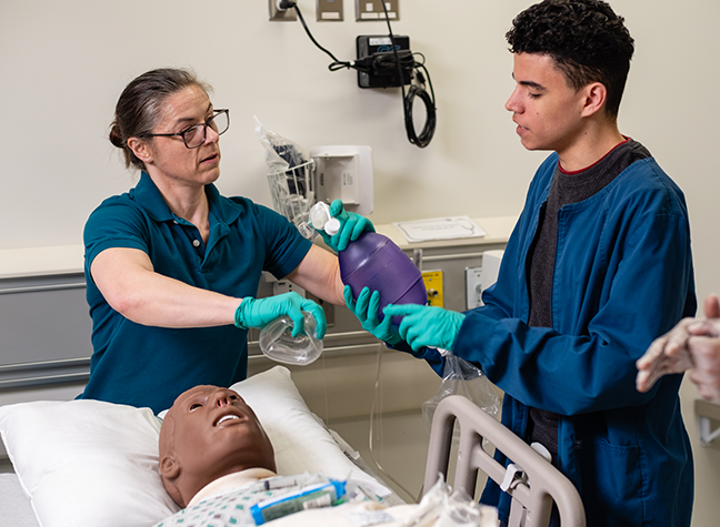 Man holding equipment in respiratory lab