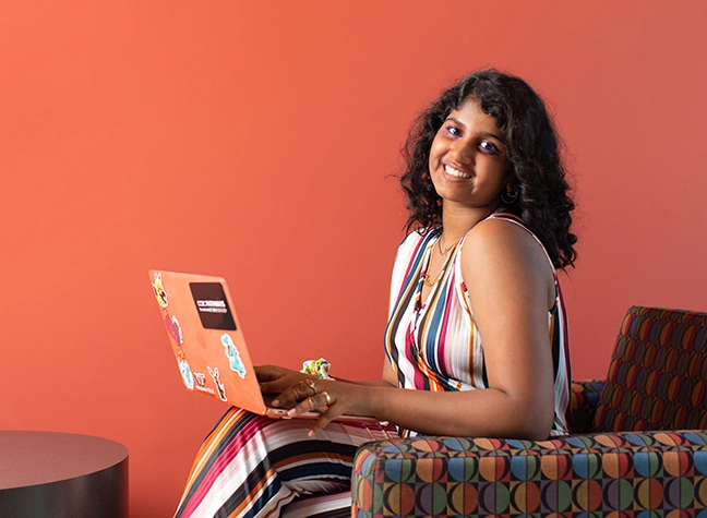 Female student with a laptop.