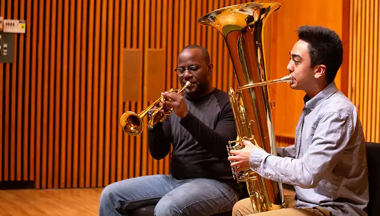 Two students perform a duet on stage