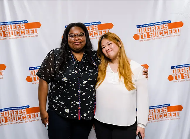 Two students attending the Degrees to Succeed Commencement Ceremony.