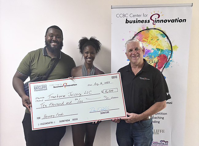 Dennis Sullivan, executive director, CCBC Center for Business Innovation presents Todd Sheridan and Nichelle Roane with a $10,000 check