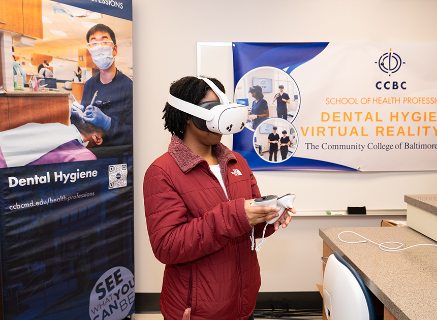 Dental student wearing virtual reality gear