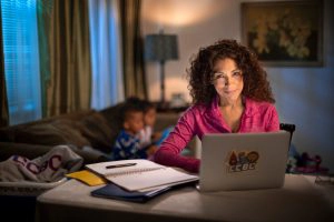 student on laptop at home