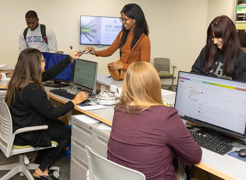 Staff helping students